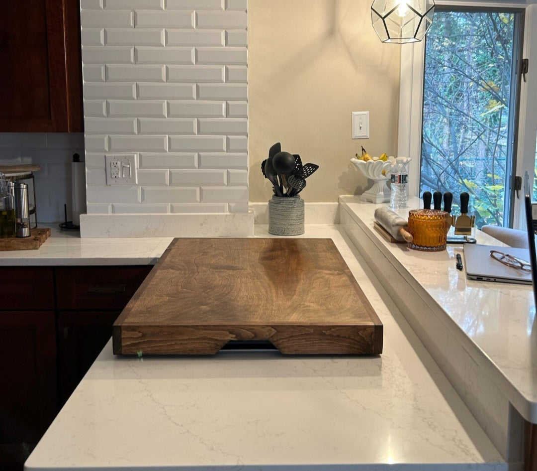 Handmade pine stove cover, box style, on a kitchen stovetop