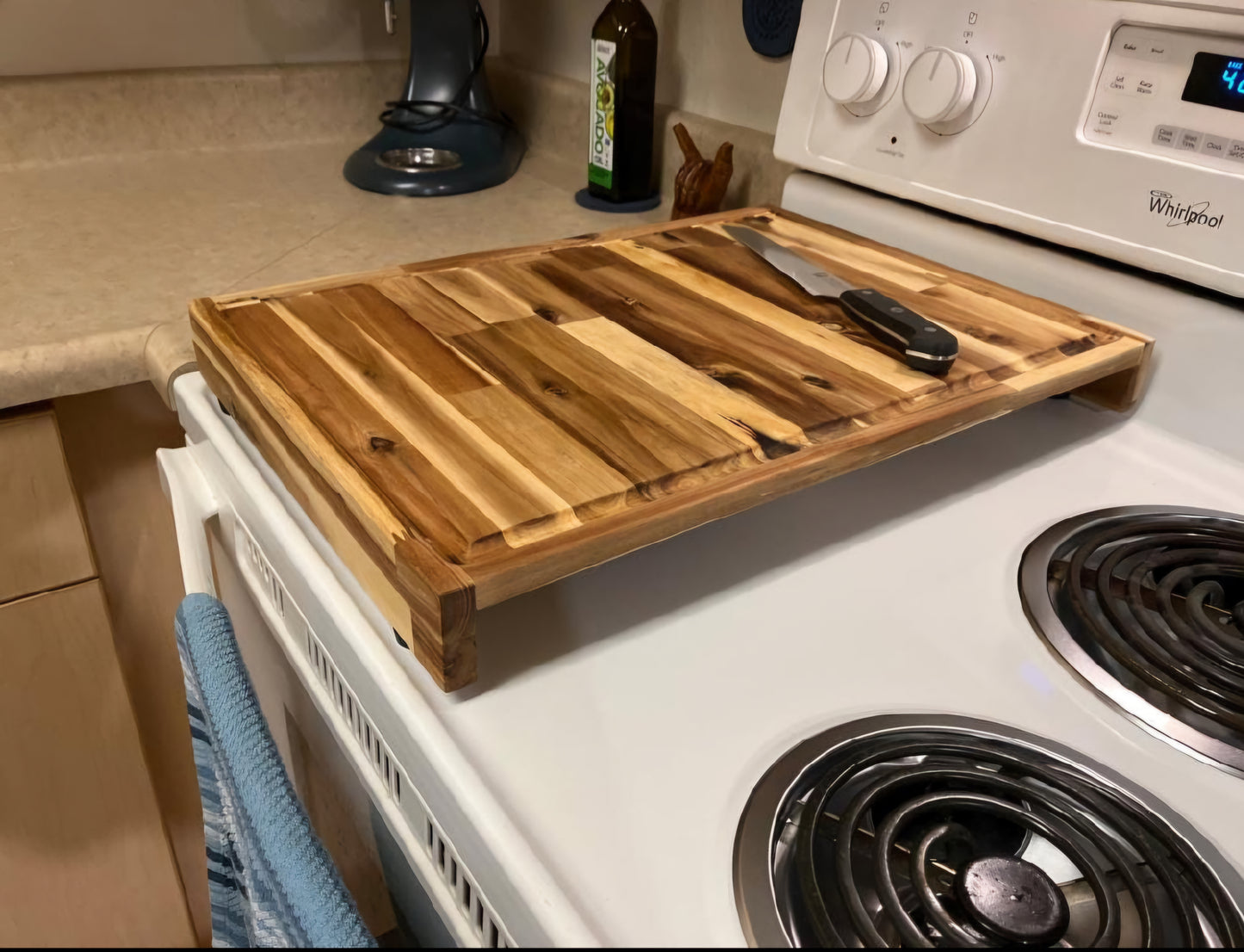 Handmade Acacia hardwood stovetop prep board fitted over a kitchen range