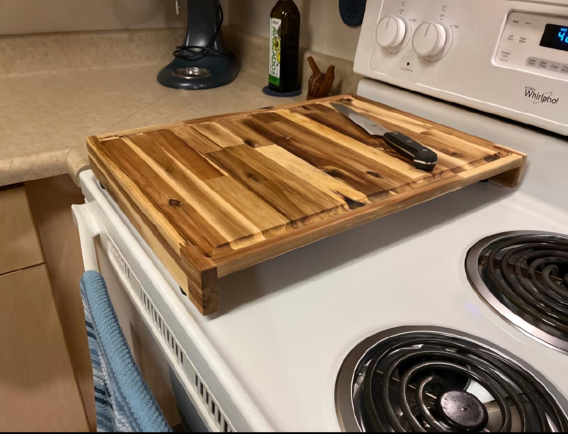 Handmade Acacia hardwood stovetop prep board fitted over a kitchen range