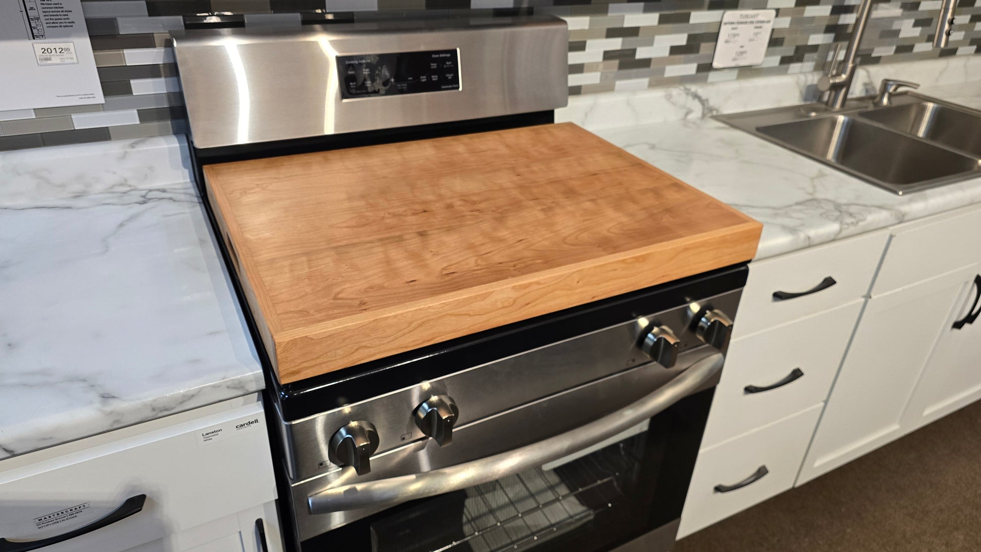 Handmade Cherry hardwood stove cover and cutting board on a kitchen stovetop