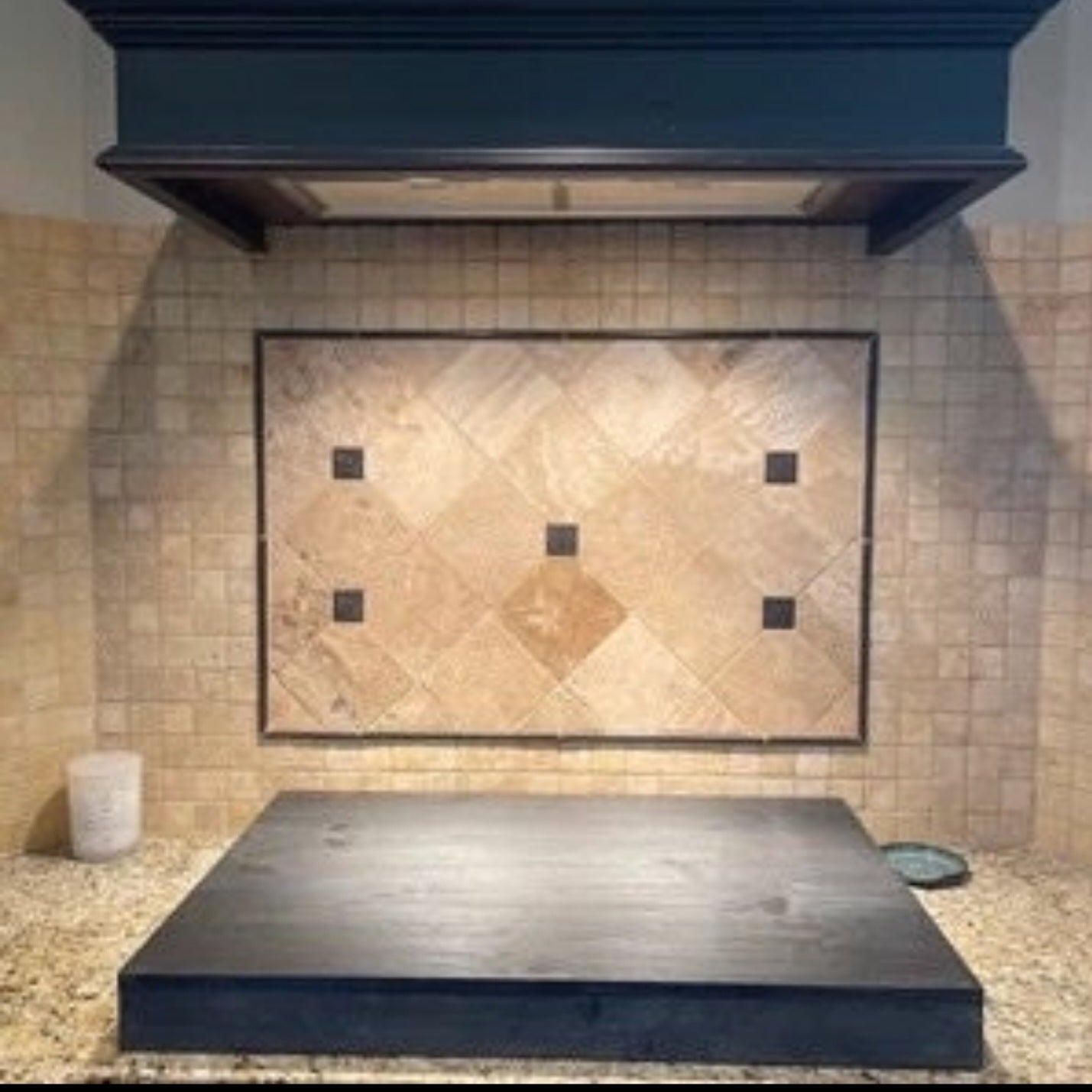 Handmade pine stove cover, box style, on a kitchen stovetop