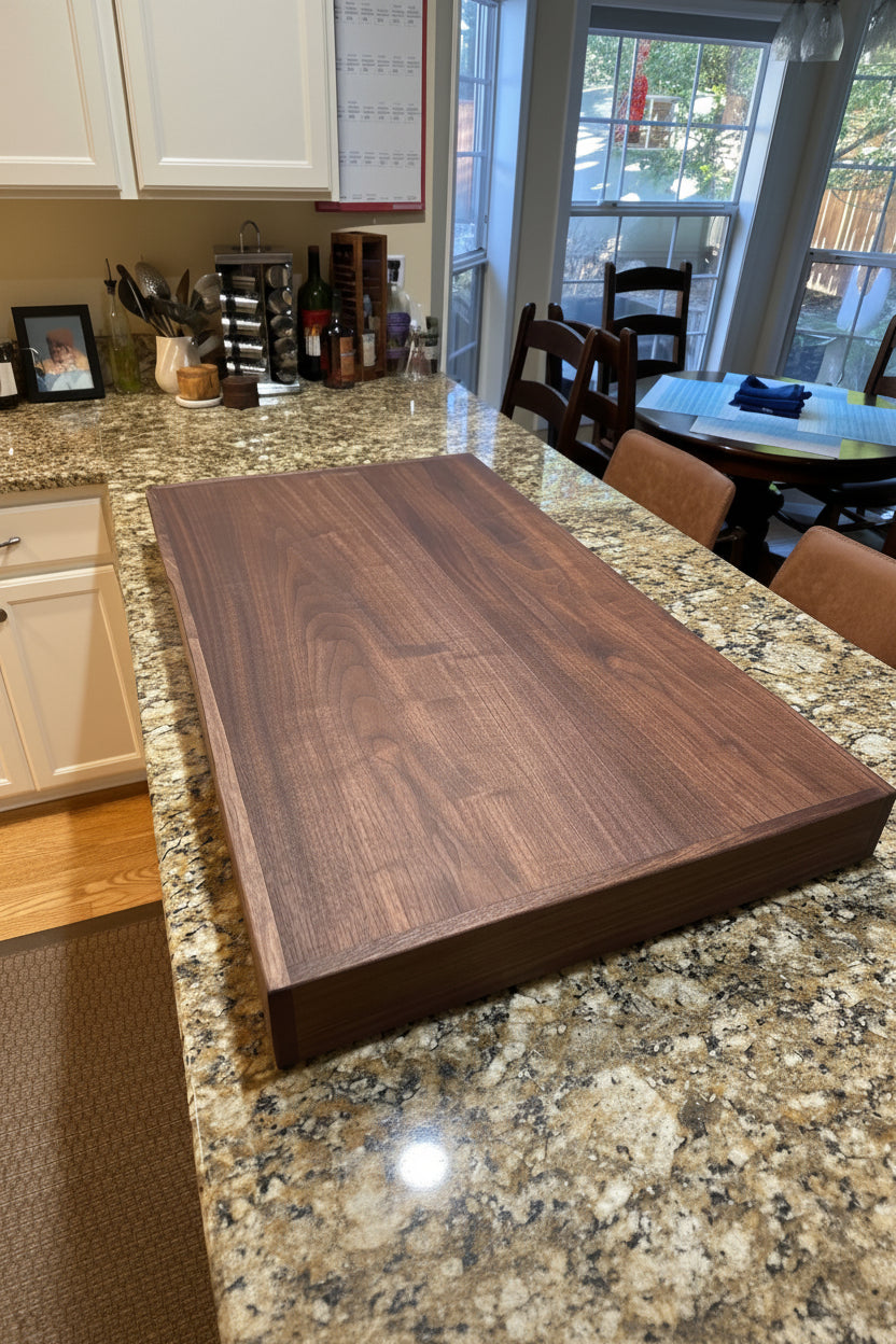 Handmade  Black Walnut hardwood stove cover and cutting board on a kitchen stovetop